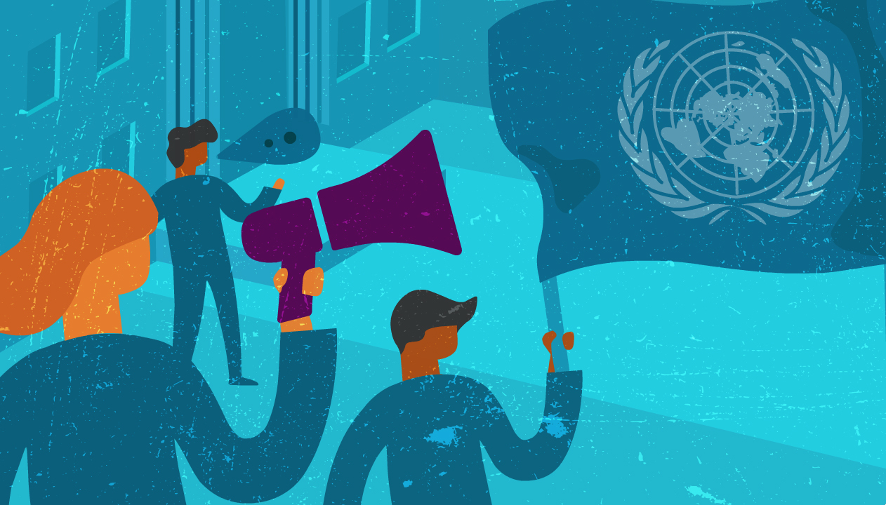 3 people holding a UN flag, a megaphone and talking